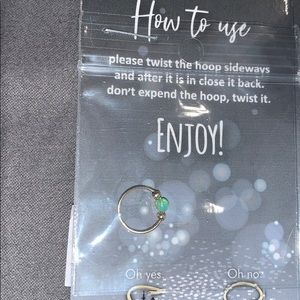 A gold nose ring-hoop-green opal piercing